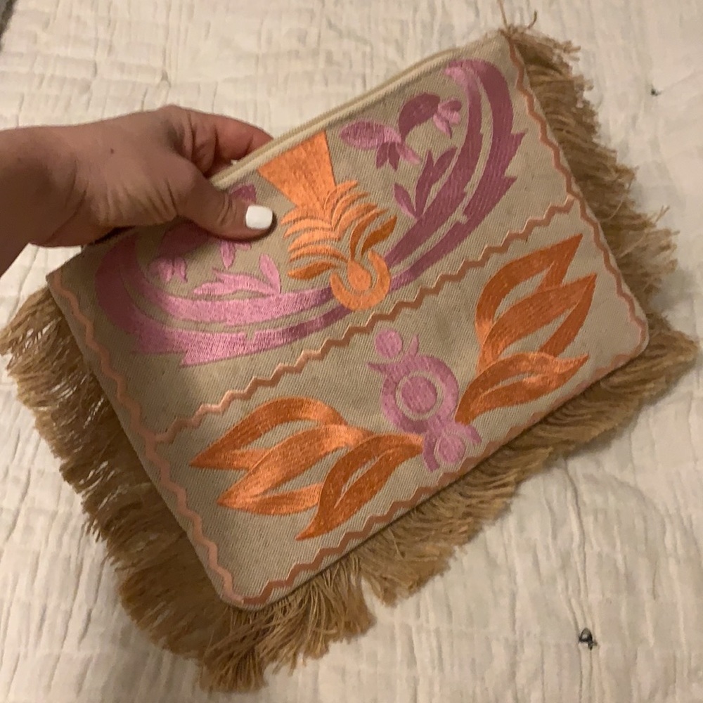 Embroidered clutch with fringe detail